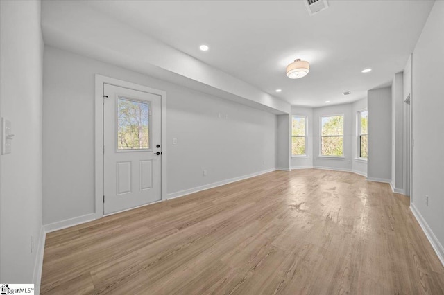 517 Windham Ln, Easley, SC 29642 - empty room with light wood-style flooring, recessed lighting, baseboards, and a healthy amount of sunlight