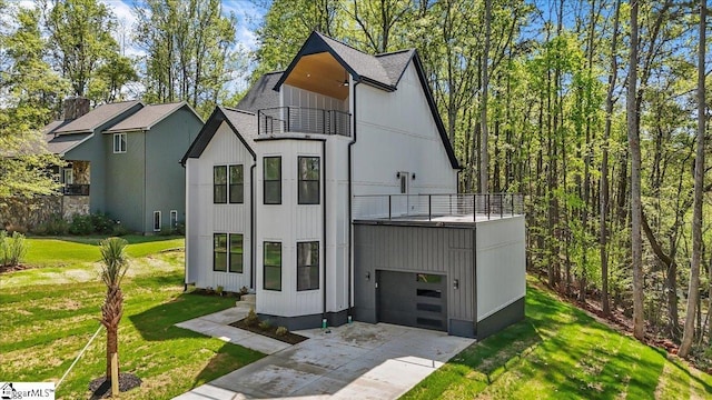 517 Windham Ln, Easley, SC 29642 - view of front of house featuring a front yard, a shingled roof, a garage, a balcony, and driveway