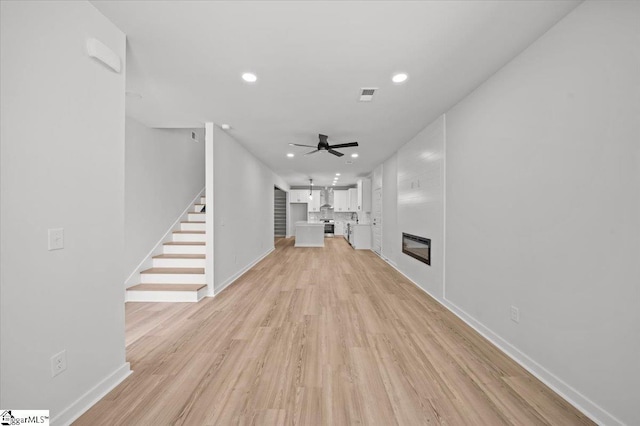 517 Windham Ln, Easley, SC 29642 - unfurnished living room featuring visible vents, ceiling fan, recessed lighting, stairs, and light wood-style flooring
