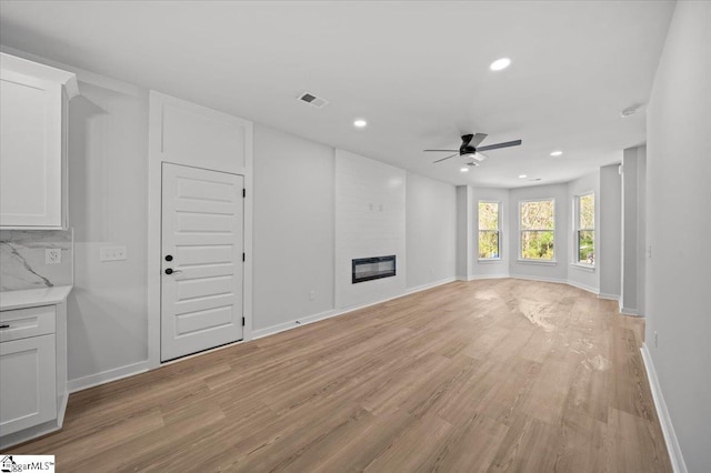 517 Windham Ln, Easley, SC 29642 - unfurnished living room with ceiling fan, light wood finished floors, recessed lighting, and a fireplace