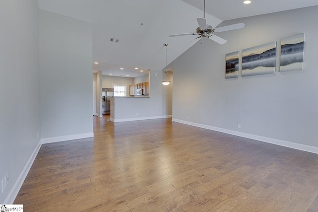 unfurnished living room featuring recessed lighting, wood finished floors, ceiling fan, baseboards, and visible vents