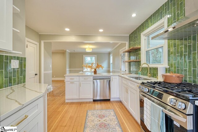 506 Parkview Dr, Spartanburg, SC 29302 - kitchen featuring light wood-style flooring, open shelves, white cabinets, a sink, and stainless steel appliances