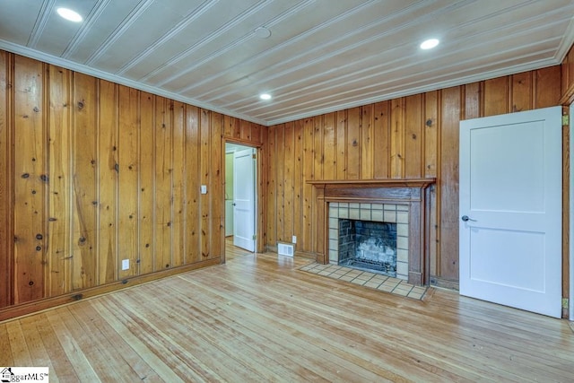 506 Parkview Dr, Spartanburg, SC 29302 - unfurnished living room featuring visible vents, light wood-style flooring, and a tile fireplace