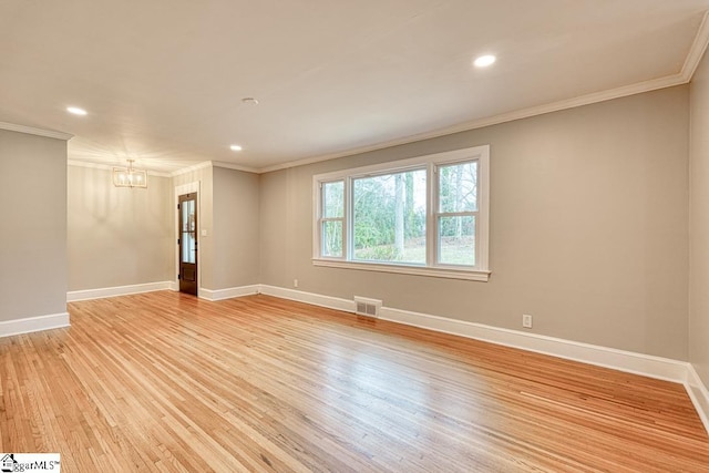 506 Parkview Dr, Spartanburg, SC 29302 - unfurnished room with a notable chandelier, visible vents, crown molding, and light wood-style flooring
