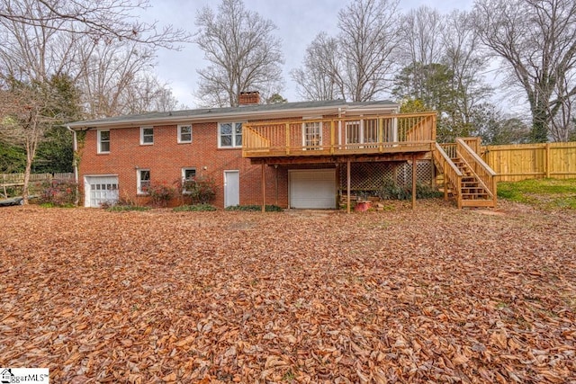 506 Parkview Dr, Spartanburg, SC 29302 - back of property with brick siding, an attached garage, fence, and a chimney
