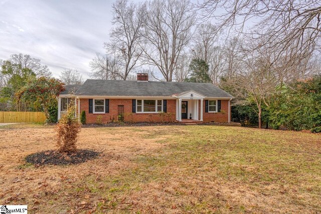 506 Parkview Dr, Spartanburg, SC 29302 - ranch-style home featuring brick siding, a front lawn, fence, and a chimney