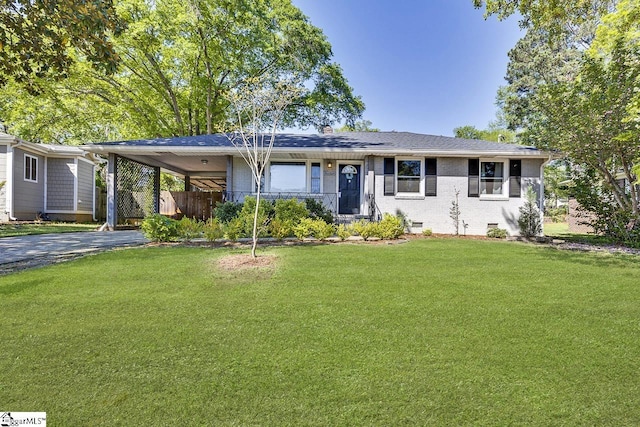 single story home with a front yard, a carport, aphalt driveway, fence, and brick siding