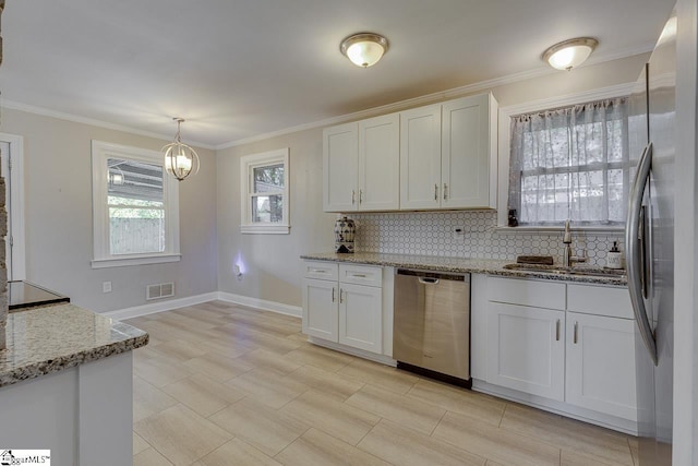 kitchen featuring a sink, visible vents, tasteful backsplash, and stainless steel appliances