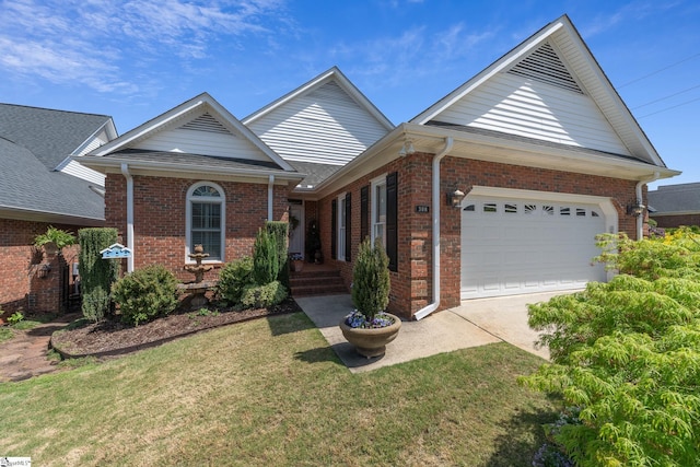 single story home featuring driveway, a front yard, and brick siding