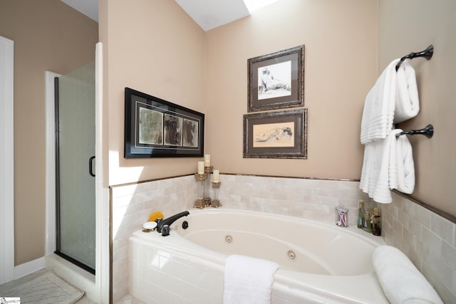 full bath with a whirlpool tub and a stall shower