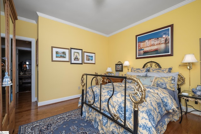 bedroom featuring wood finished floors, baseboards, and ornamental molding