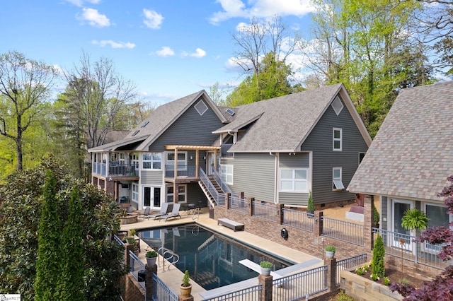 902 Altamont Rd, Greenville, SC 29609 - back of property featuring a fenced backyard, a fenced in pool, a patio, and stairs