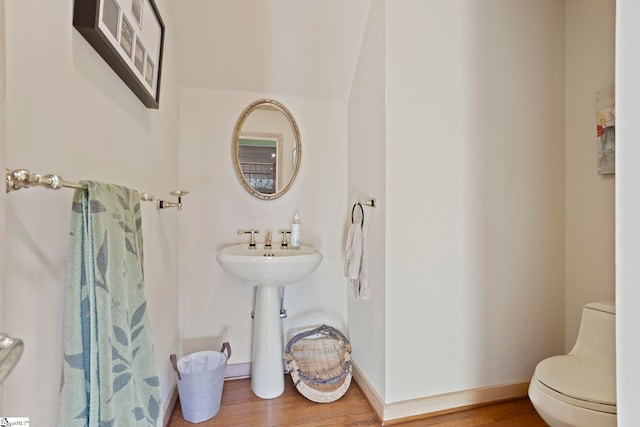 902 Altamont Rd, Greenville, SC 29609 - bathroom featuring toilet, wood finished floors, and baseboards