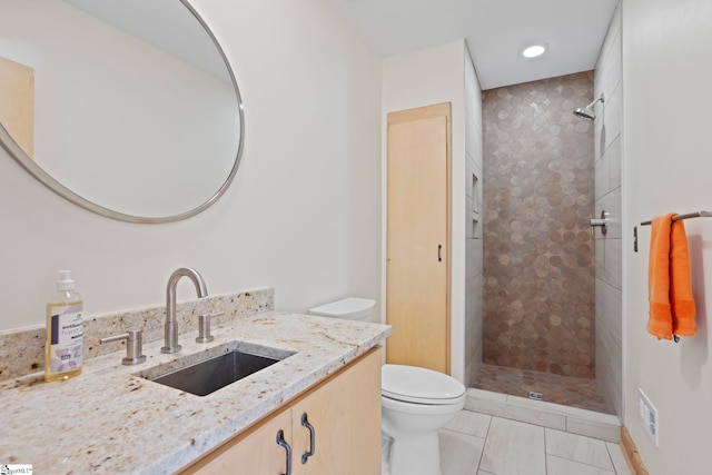 902 Altamont Rd, Greenville, SC 29609 - bathroom with tile patterned floors, tiled shower, vanity, and toilet