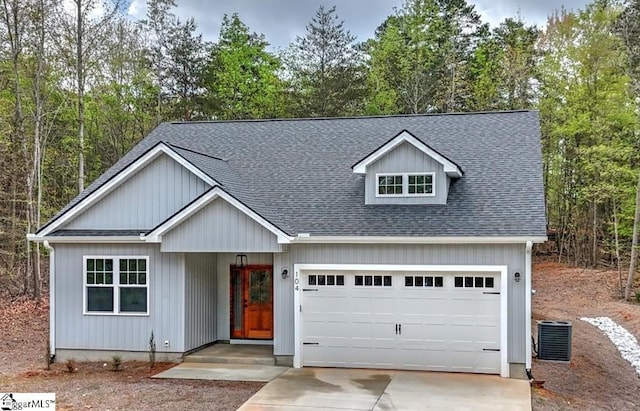 104 Player Ln, Westminster, SC 29693 - view of front of property featuring driveway, central air condition unit, roof with shingles, and a garage