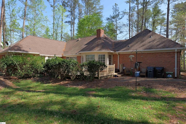 106 Carolina Club Dr, Spartanburg, SC 29306 - back of house featuring brick siding, a yard, a wooden deck, and a chimney