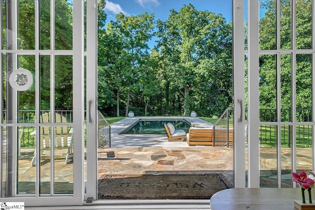 outdoor pool with a patio area