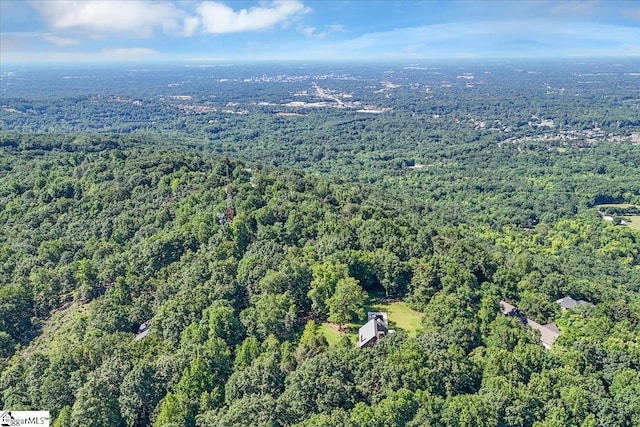 bird's eye view featuring a view of trees