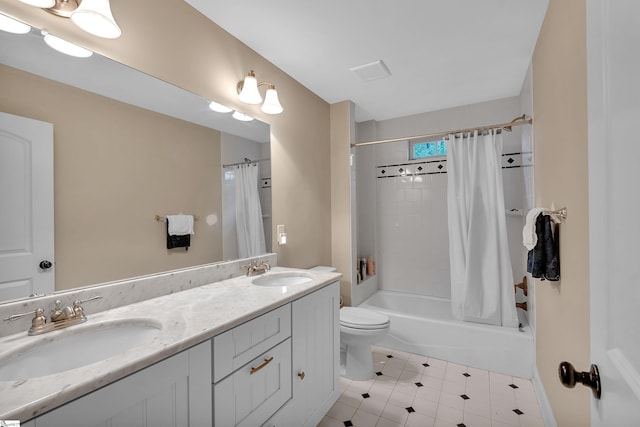 full bath with double vanity, shower / bathtub combination with curtain, a sink, and toilet