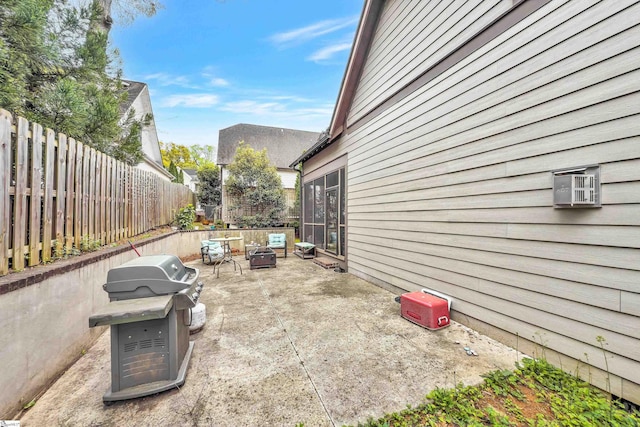 exterior space with an outdoor fire pit, a patio, and a fenced backyard