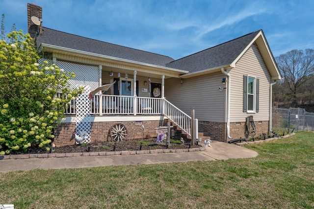 100 Sonora Dr, Easley, SC 29640 - view of front of property featuring a chimney, a front lawn, fence, a shingled roof, and covered porch