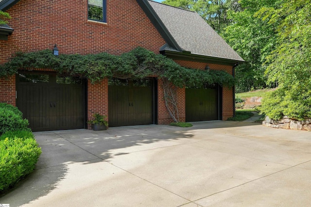 garage featuring driveway