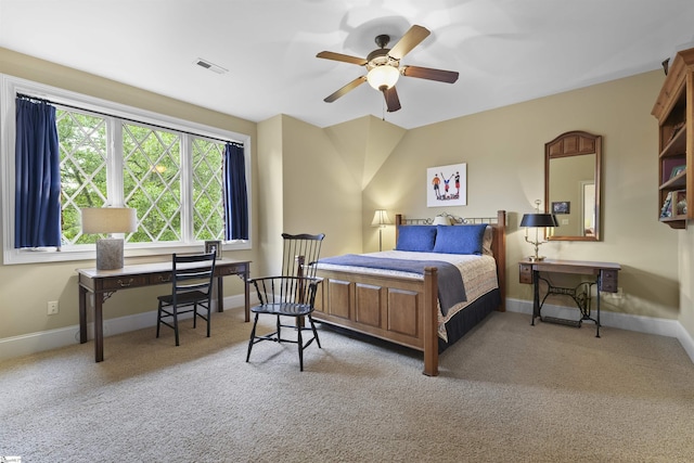 bedroom with ceiling fan, visible vents, baseboards, and carpet floors