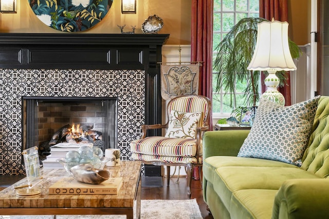 sitting room with a tiled fireplace