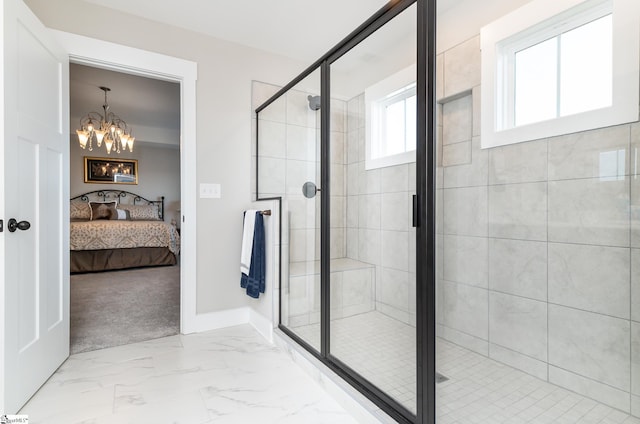 full bathroom with a notable chandelier, baseboards, connected bathroom, a shower stall, and marble finish floor
