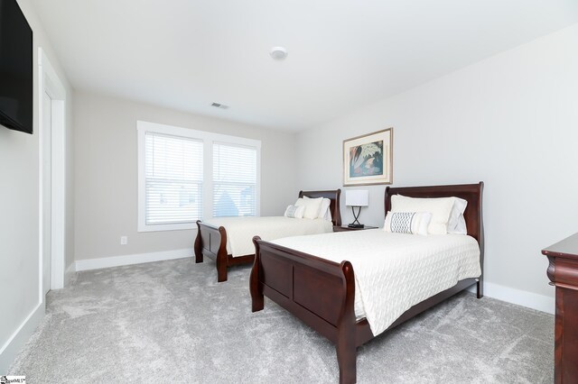 bedroom with visible vents, baseboards, and carpet floors