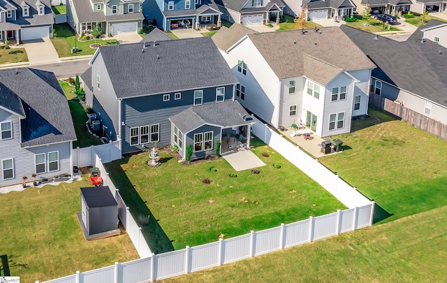 birds eye view of property with a residential view