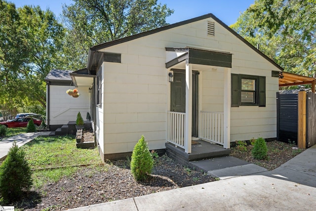 view of front of house featuring fence