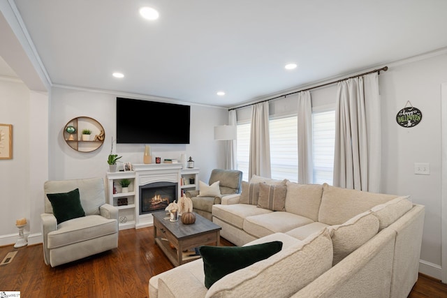 living room with ornamental molding, dark wood-style floors, and recessed lighting