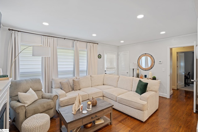 living area featuring ornamental molding, baseboards, dark wood finished floors, and recessed lighting