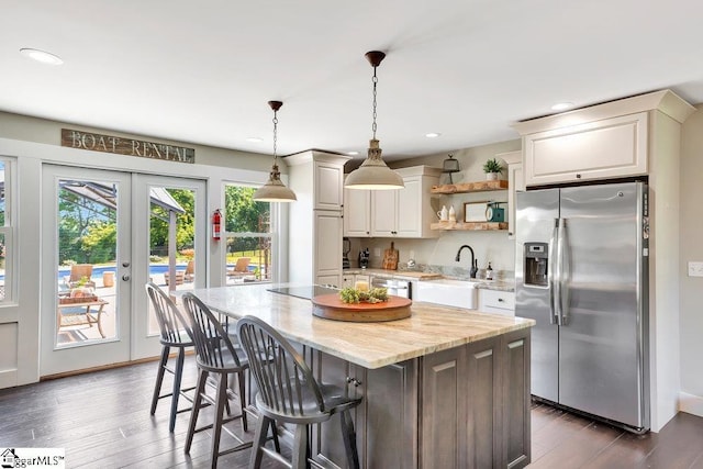 221 Lakeside Dr, Seneca, SC 29672 - kitchen featuring open shelves, a kitchen island, a sink, stainless steel appliances, and dark wood-style floors