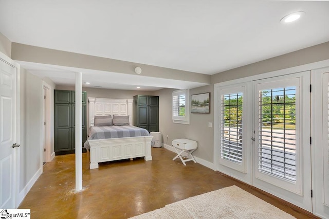 221 Lakeside Dr, Seneca, SC 29672 - unfurnished bedroom featuring recessed lighting, finished concrete flooring, access to exterior, and baseboards