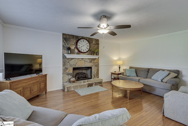 105 Berrywood Ct, Greer, SC 29650 - living room with a ceiling fan, a stone fireplace, crown molding, and wood finished floors