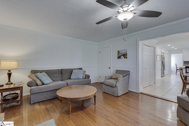105 Berrywood Ct, Greer, SC 29650 - living area with light wood finished floors, ornamental molding, baseboards, and ceiling fan