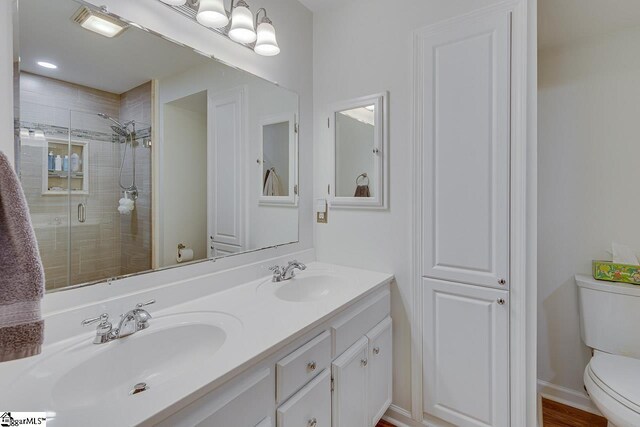 105 Berrywood Ct, Greer, SC 29650 - bathroom featuring a sink, double vanity, toilet, and a shower stall
