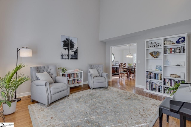 105 Berrywood Ct, Greer, SC 29650 - sitting room featuring baseboards, a high ceiling, and wood finished floors