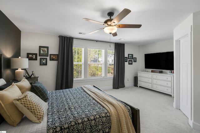 bedroom with ceiling fan, visible vents, baseboards, and carpet floors