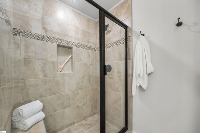 full bathroom featuring a shower stall and ornamental molding