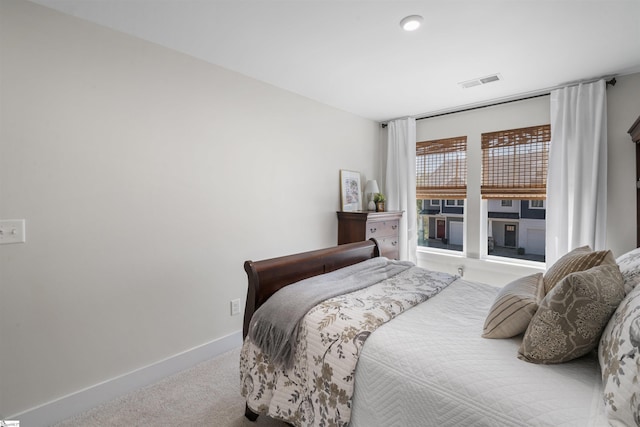 bedroom with visible vents, baseboards, and carpet flooring
