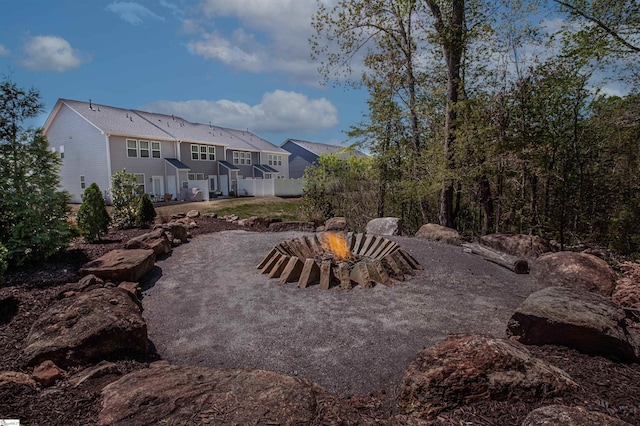 view of yard with a fire pit