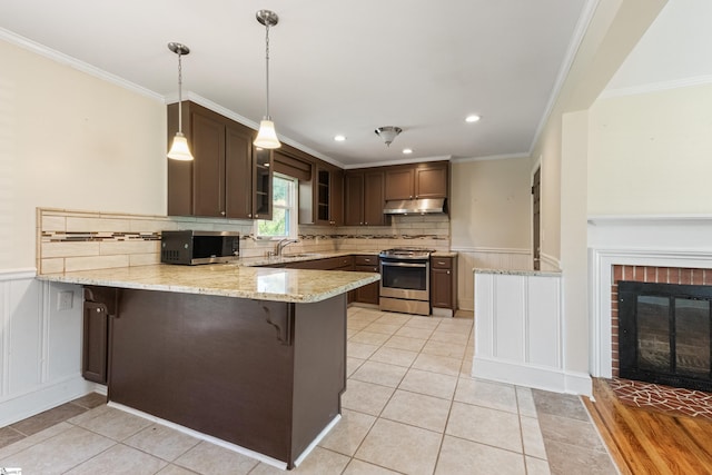 105 Pinewood Ave, Clinton, SC 29325 - kitchen with light tile patterned floors, a peninsula, under cabinet range hood, a sink, and stainless steel appliances