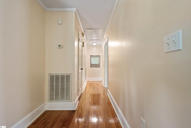 105 Pinewood Ave, Clinton, SC 29325 - hallway with visible vents, baseboards, crown molding, attic access, and wood finished floors