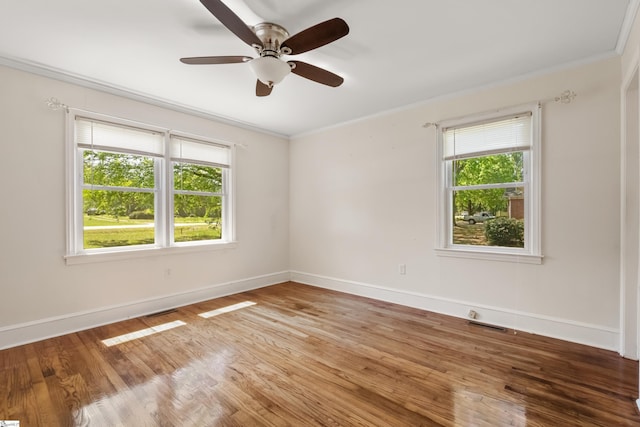 105 Pinewood Ave, Clinton, SC 29325 - empty room with light wood finished floors, ornamental molding, and a healthy amount of sunlight