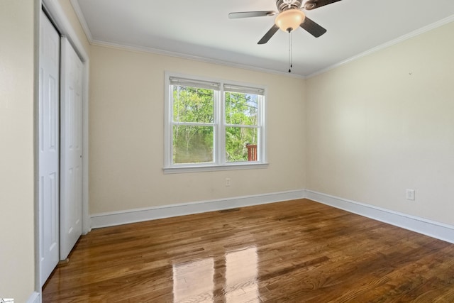 105 Pinewood Ave, Clinton, SC 29325 - unfurnished bedroom featuring wood finished floors, baseboards, ornamental molding, and visible vents