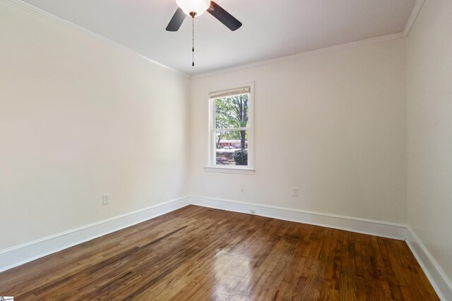 105 Pinewood Ave, Clinton, SC 29325 - spare room featuring dark wood-type flooring, baseboards, ornamental molding, and ceiling fan