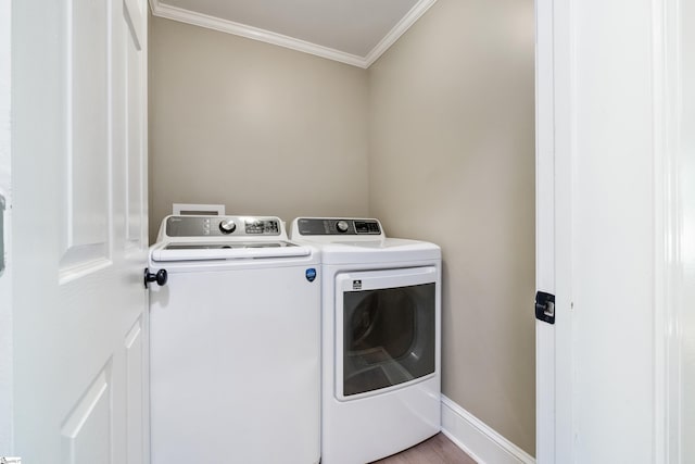 105 Pinewood Ave, Clinton, SC 29325 - washroom featuring baseboards, laundry area, crown molding, wood finished floors, and washing machine and dryer